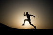 © be free - silhouette or man runner, guy running outdoor at clear sky