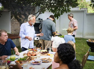 Wall Mural - Group of diverse people enjoying barbecue party together