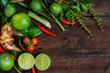 Herb and spicy ingredients for making Thai food. Recipe book with fresh herbs south asia and spices on wooden background, (concept thai food),top view