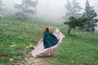 © SHOTPRIME STUDIO - Young beautiful woman is walking in the mountains near the trees