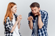 © SHOTPRIME STUDIO - Young beautiful woman with a guy with a beard on white isolated background, repair, construction tools