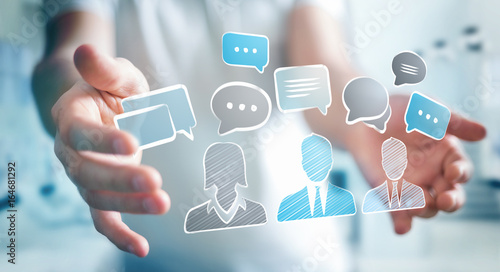 Cuadros en Lienzo Businessman holding discussion icons sketch