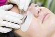 © lester120 - Woman on the procedure for eyelash extensions, eyelashes lamination