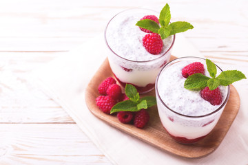 Raspberries chia pudding and fruit smoothie with mint