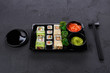 Set of sushi maki and rolls closeup in delivery box