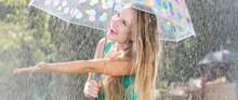 Blonde Woman Enjoying Summer Rain