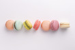 Macarons on white background. Colorful french desserts. Top view
