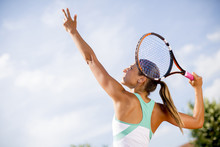 Young Woman Playing Tennis