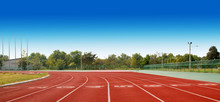 Running Track With Lanes Over Sky And Clouds