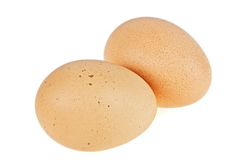 Two chicken eggs close-up, isolated on a white background