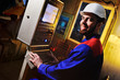 © Evgeniy Kalinovskiy - Handsome man working behind the remote control in the cockpit of the factory.Man, factory, remote