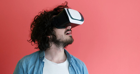 young man using VR headset glasses of virtual reality