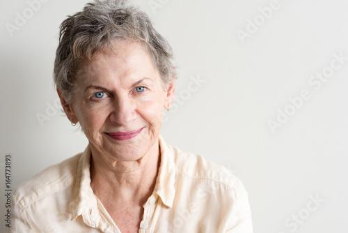 Portrait Of Beautiful Older Woman With Short Grey Hair And