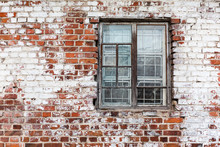 Wooden Window On Weathered Red Brick Wall Painted White