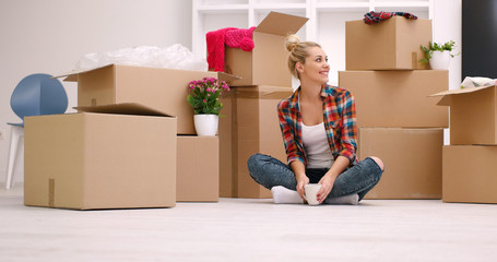 Wall Mural - woman with many cardboard boxes sitting on floor