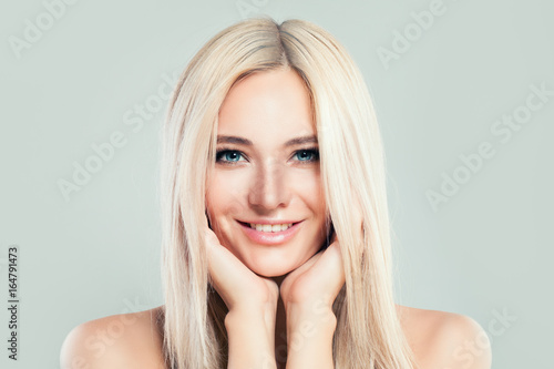 Blonde Model Woman With Healthy Skin And Blonde Hairstyle
