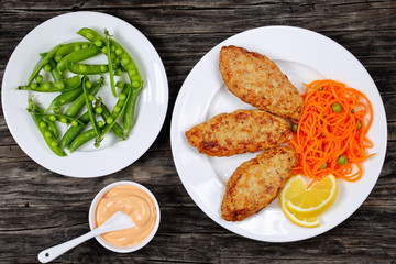 Canvas Print - juicy chicken turkey cutlets with salad