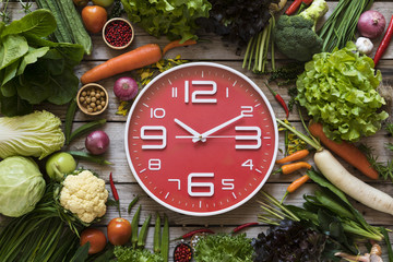 Food clock. Healthy food concept on wooden table