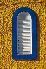 Blue Window On The Yellow Wall