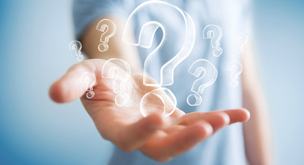 Fototapete - Businessman holding hand drawn question marks
