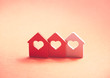 Three small houses with heart