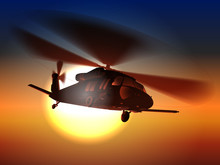 Silhouette Helicopter Black Hawk Helicopter Flies In Sunset.