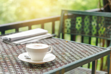 Wall Mural - Stock photo :.Cappuccino coffee on old iron table and vintage background