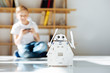 © zinkevych - Fair-haired little boy enjoying his new robot toy