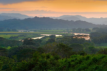 Rio Tarcoles, Carara National Park, Costa Rica. Sunset In Beautiful Tropic Forest Landscape. Meander Of River Tarcoles. Hills With Orange Evening Sky. Holiday In Costarica. Travel In Central America.
