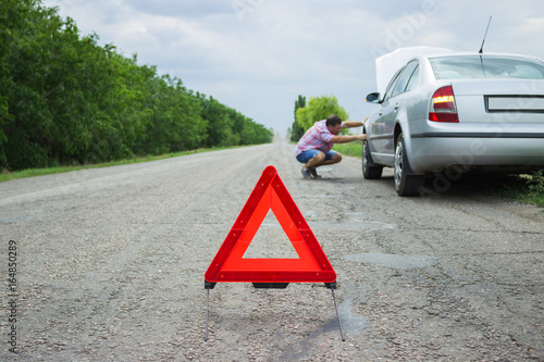 Red Warning Triangle With A Broken Down Car Breakdown Of The In Red Warning Triangle With A Broken Down Car Breakdown Of The In Bad Weather