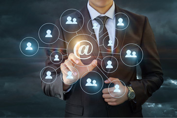 Businessman doing a mass mailing to network .