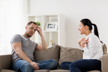 Poster - unhappy couple having argument at home