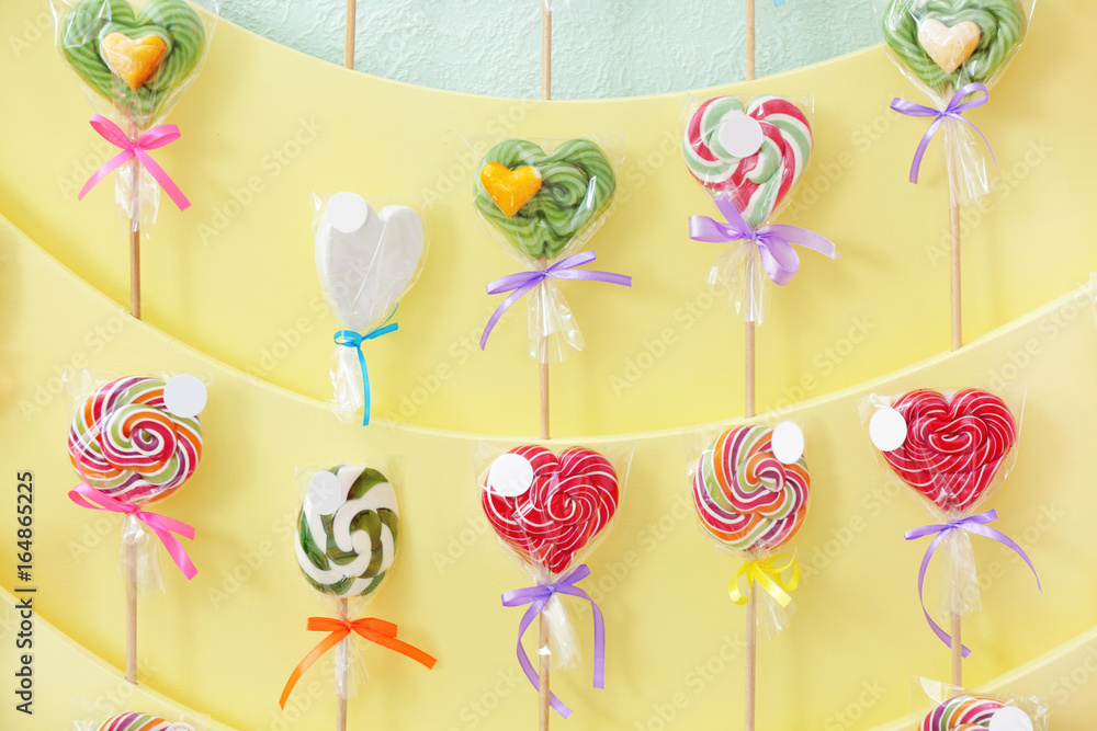 Different lollipops on showcase at candy shop