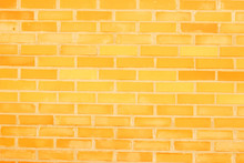 Yellow Painted Brick Wall Texture Background. Abstract Wallpaper. Close Up