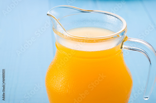 Download Glass Jug Of Yellow Juice On A Blue Background Jug Of Yellow Juice On A Blue Background Buy This Stock Photo And Explore Similar Images At Adobe Stock Adobe Stock PSD Mockup Templates