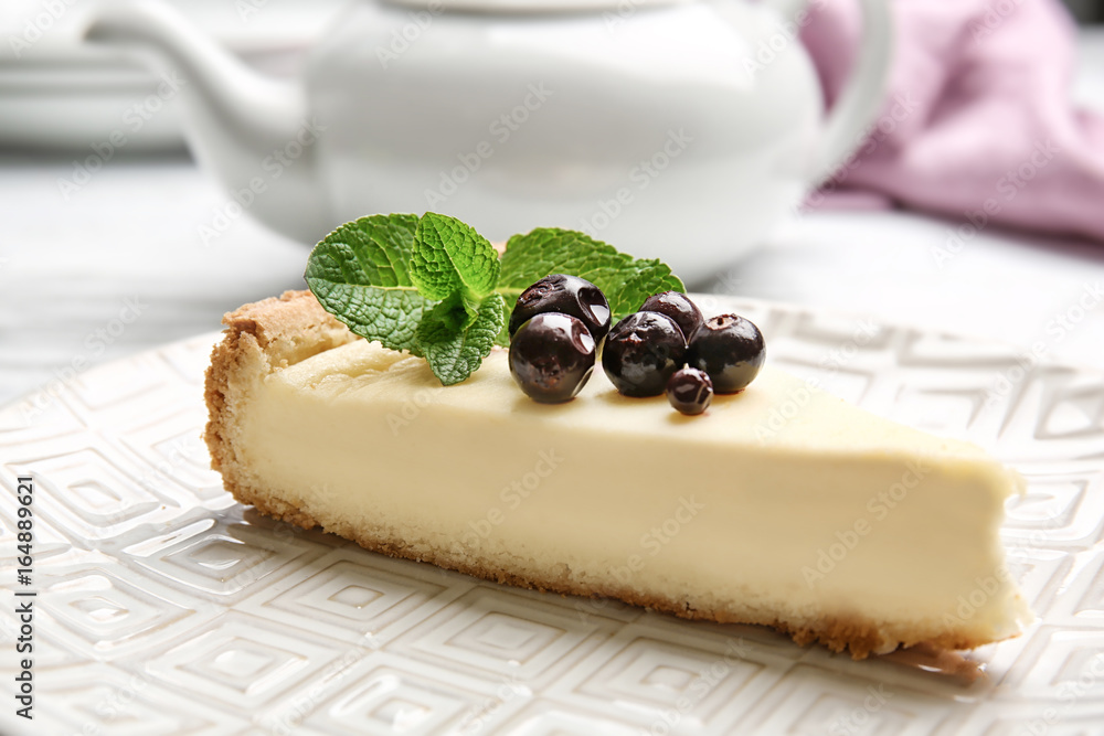 Plate with delicious cheesecake and berries, closeup