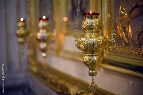 Fotografia, Obraz iron censer hanging above the large icon in the Church