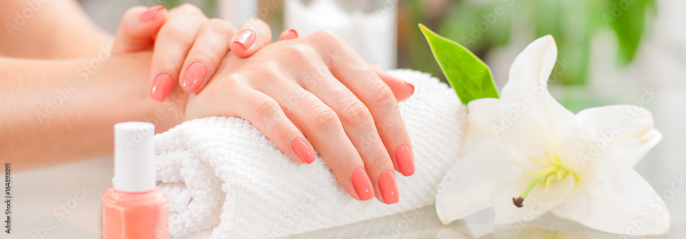 Manicure concept. Beautiful woman's hands with perfect manicure at  beauty salon. - obrazy, fototapety, plakaty 