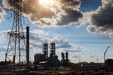 engineers standing surrounded by pipelines oil and gas industry