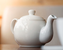 Close-up Of White Teapot On The Table.