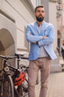 © Fxquadro - Portrait of elegant bearded guy near the retro bicycle.