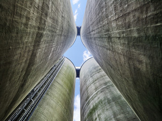 old grunge conctrete silo against blue sky