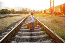 Boy In Checkered Shirt Standing On Railways