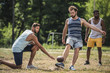 © LIGHTFIELD STUDIOS - group of young multicultural men playing football on court