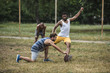 © LIGHTFIELD STUDIOS - group of young multicultural men playing football on court
