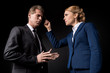 © LIGHTFIELD STUDIOS - middle aged business colleagues having conflict and quarreling isolated on black