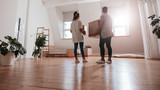 Fototapeta  - Young couple moving in new house