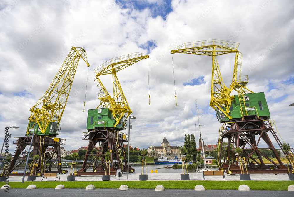 Renovated cranes on the boulevards in Szczecin on a sunny summer day - obrazy, fototapety, plakaty 
