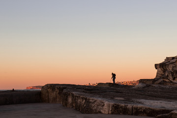 Canvas Print - a photographer capturing sunrise light