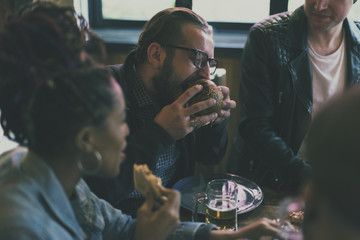 Wall Mural - Friends all together at restaurant having meal